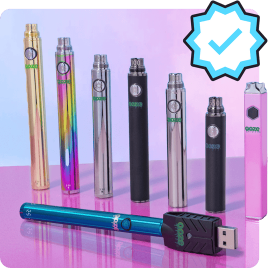 A line up of 7 different Ooze thc cart batteries in front of one Ooze vape battery for carts laying in front