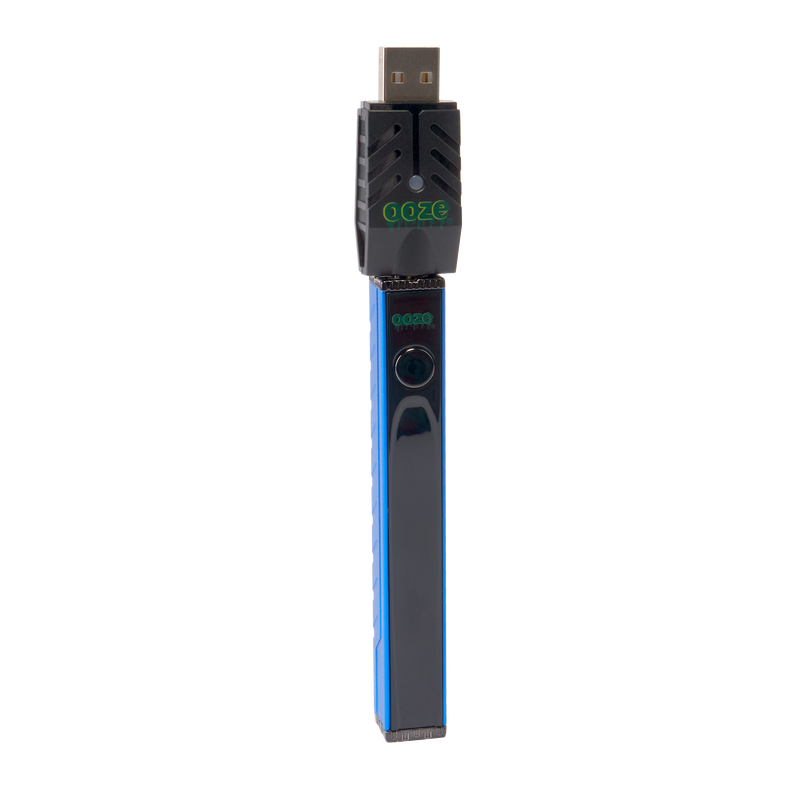 Angled view of the blue Ooze Quad 2 square vape with 510 charger attached on a white background
