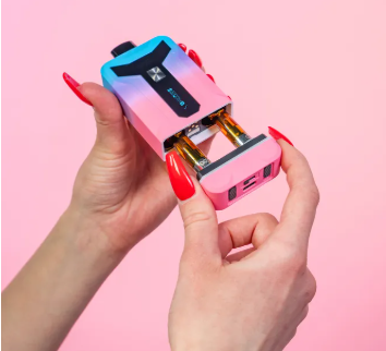 Pulling base out of twilight Duet battery to show two attached carts