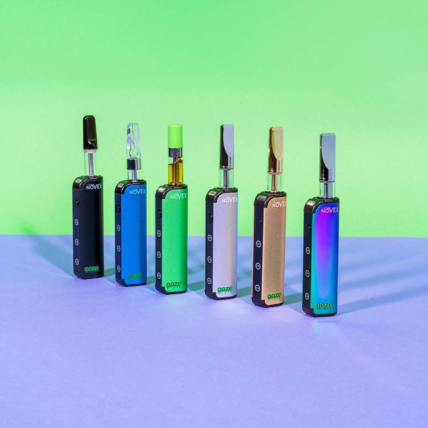 All 6 colors of the Ooze Novex are lined up, each has a 510 cartridge inserted