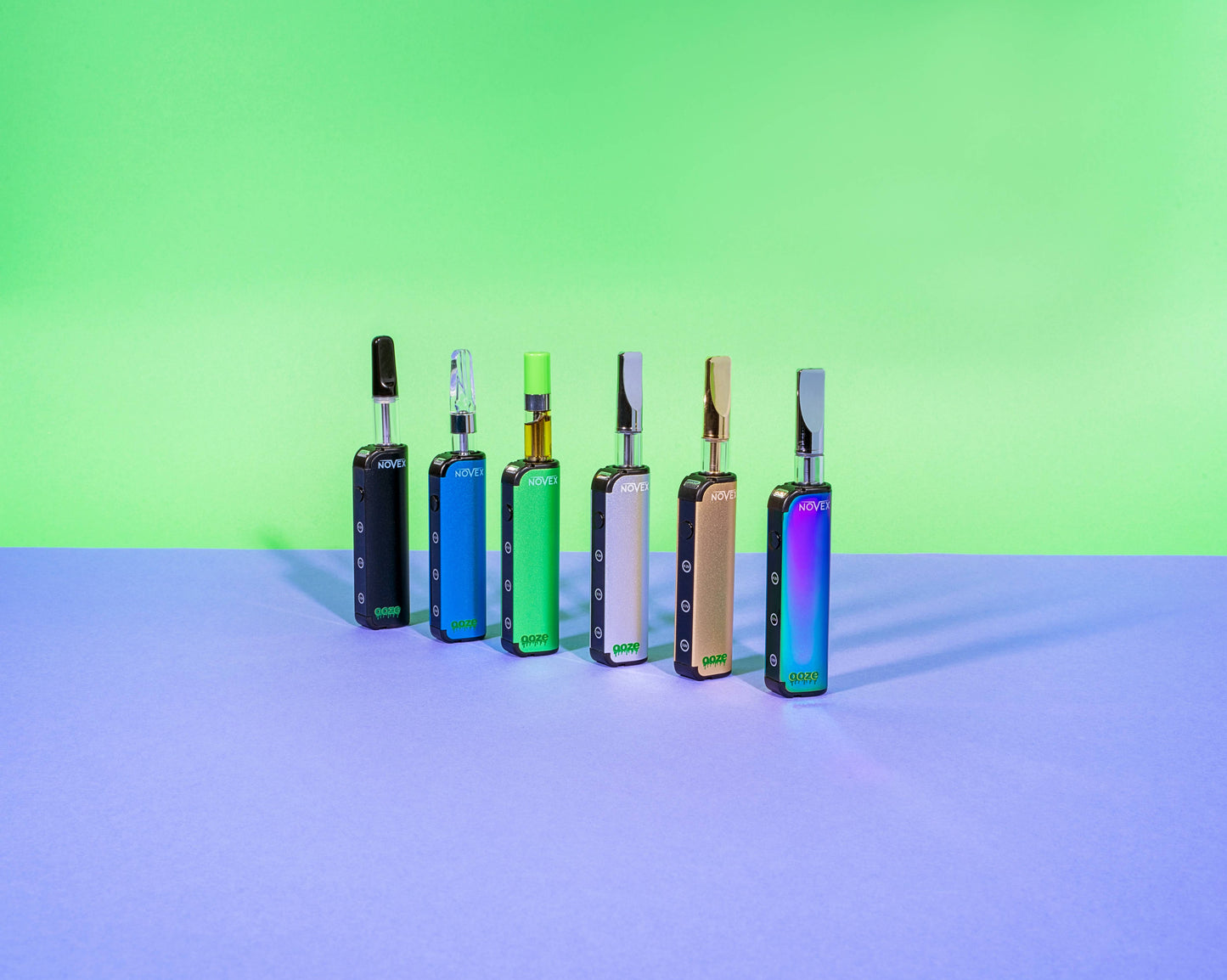 All 6 colors of the Ooze Novex are lined up, each has a 510 cartridge inserted