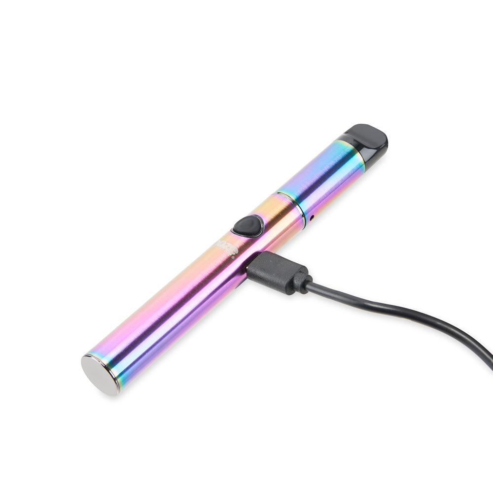 The Rainbow Ooze Signal is laying on its side with the micro USB charger plugged into the port.