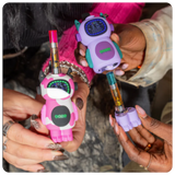 Two colorful Bot vape devices shaped like little robots held by hands.