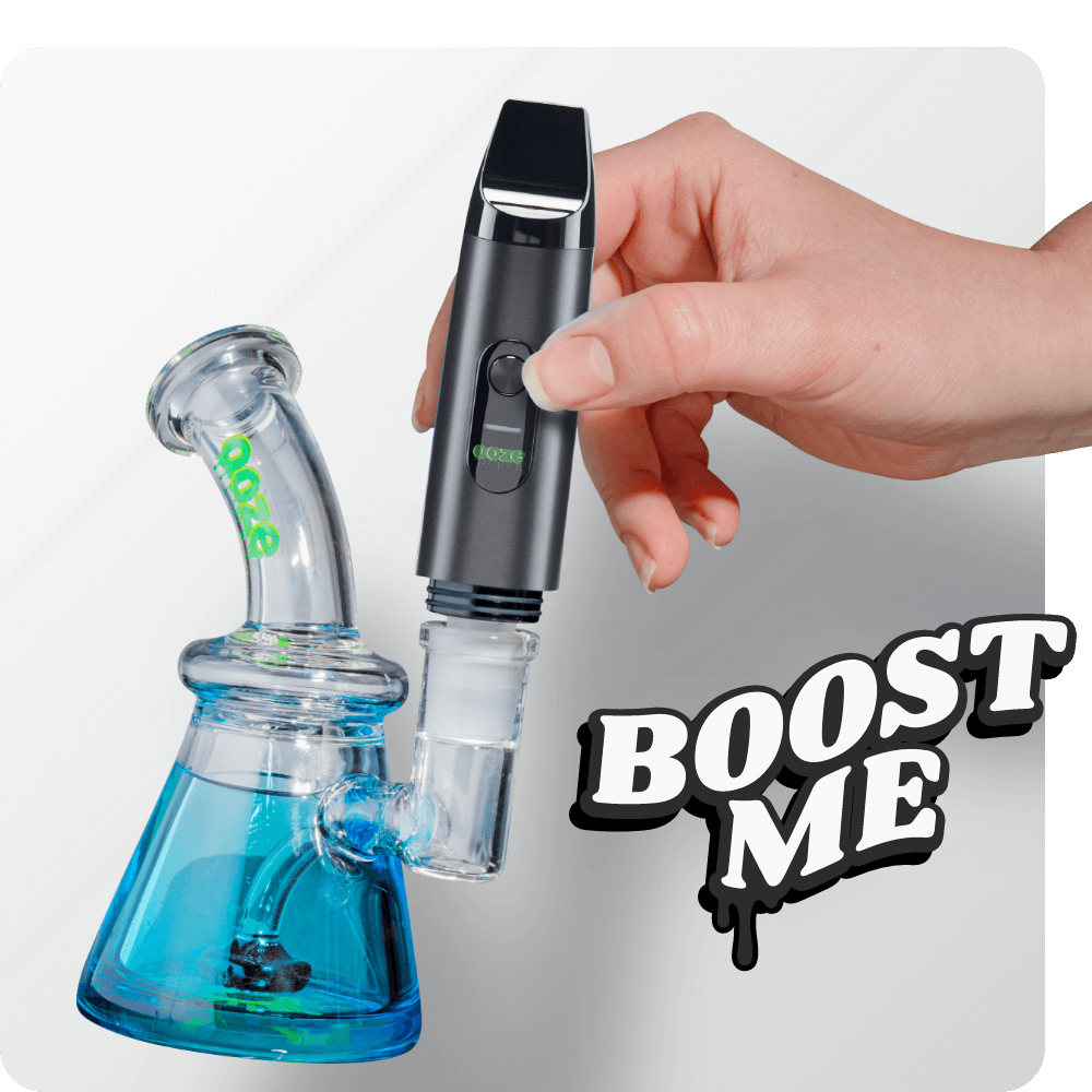 Person attaching the Black Booster extract vape to dab rig
