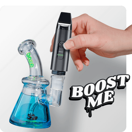 Person attaching the Black Booster extract vape to dab rig
