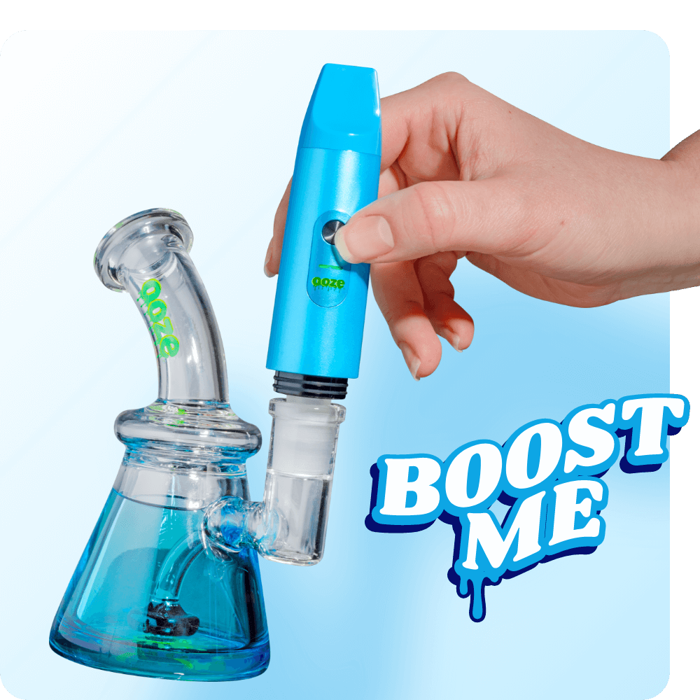 Person attaching the Light Blue Booster extract vape to dab rig
