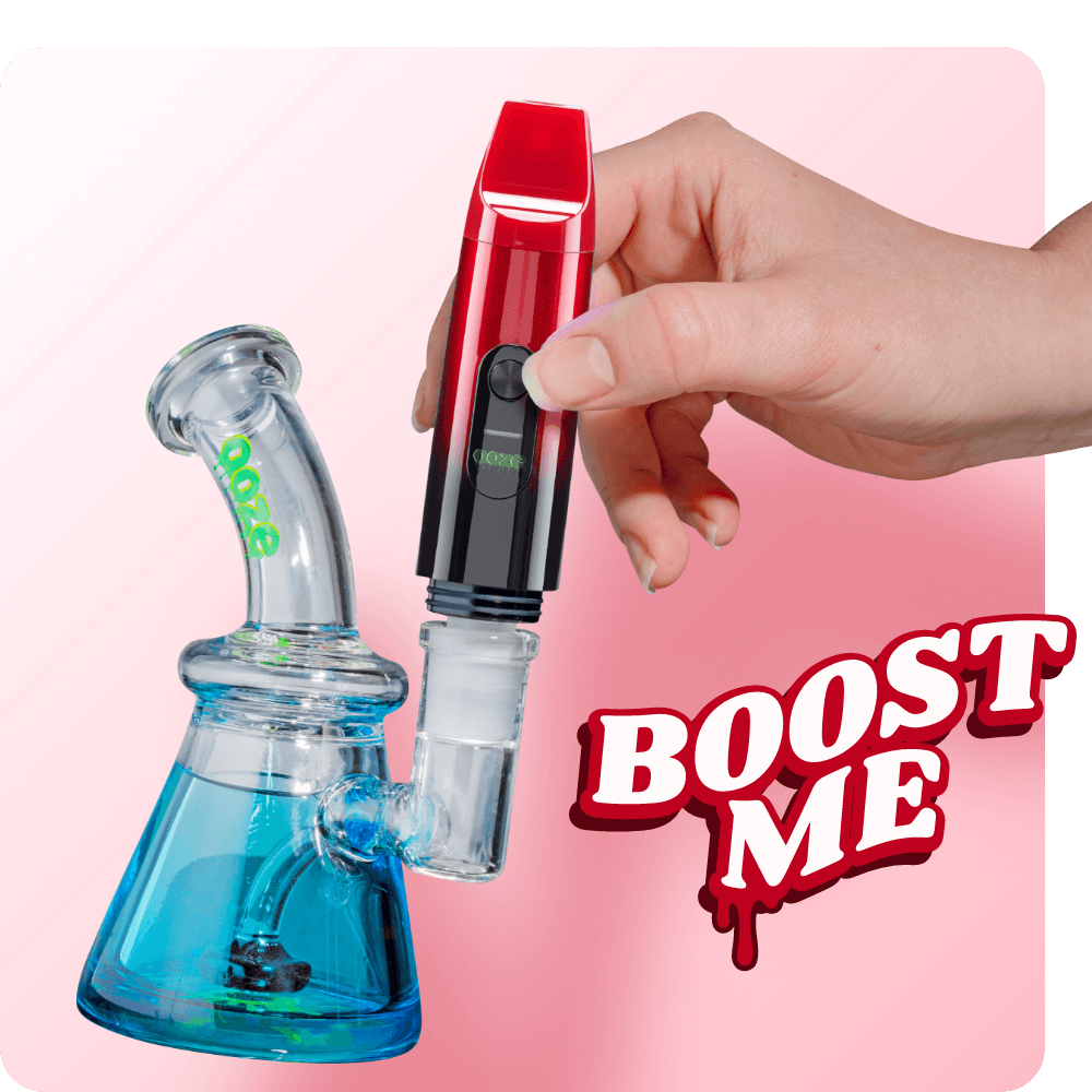 Person attaching the Red Booster extract vape to dab rig
