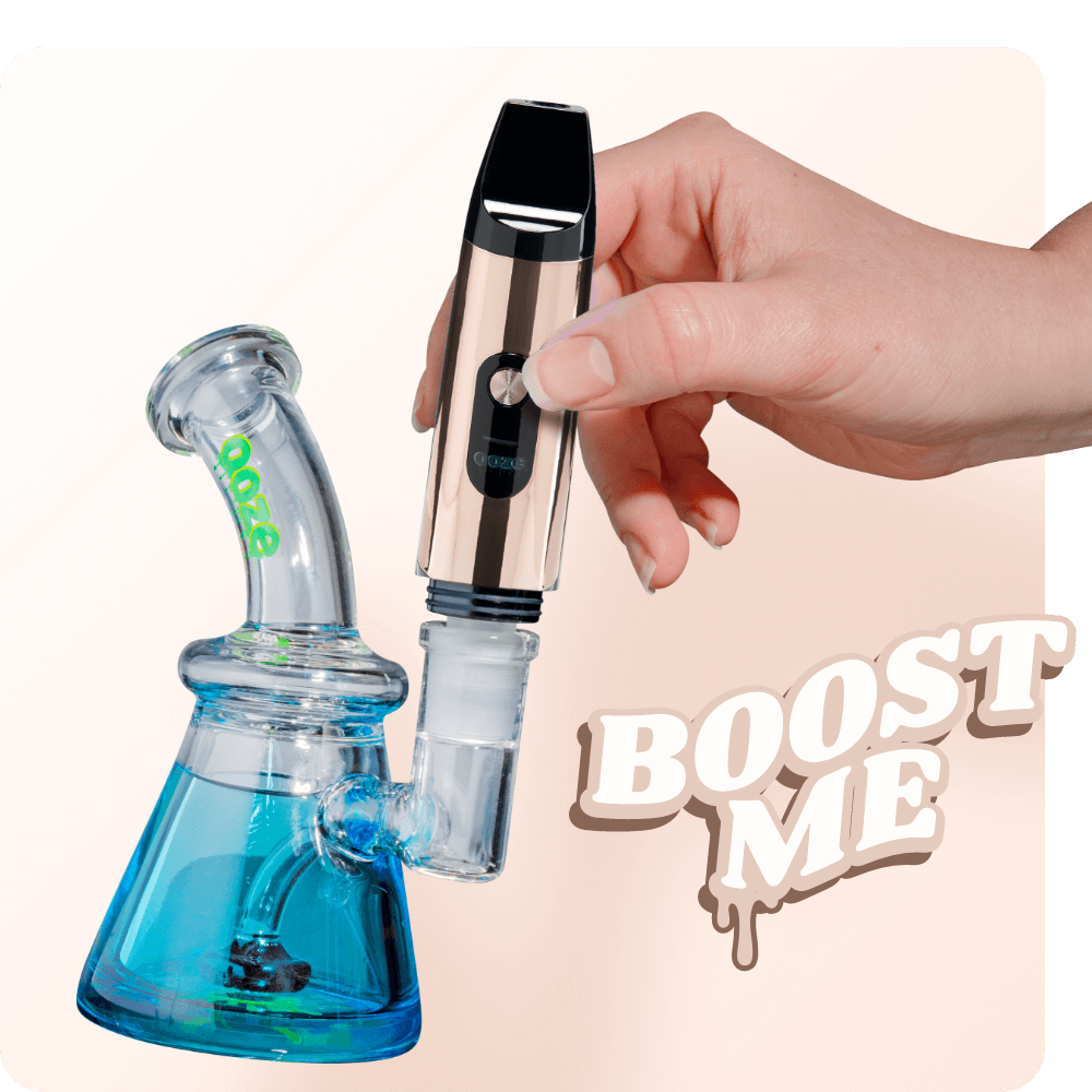 Person attaching the Rose Gold Booster extract vape to dab rig
