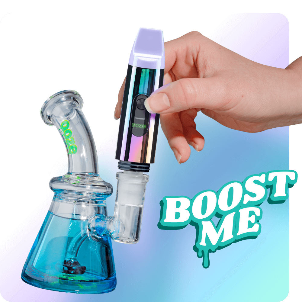 Person attaching the Rainbow Booster extract vape to dab rig
