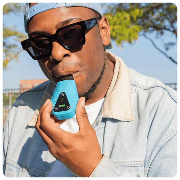 Ooze Brink Dry herb vape in use outside