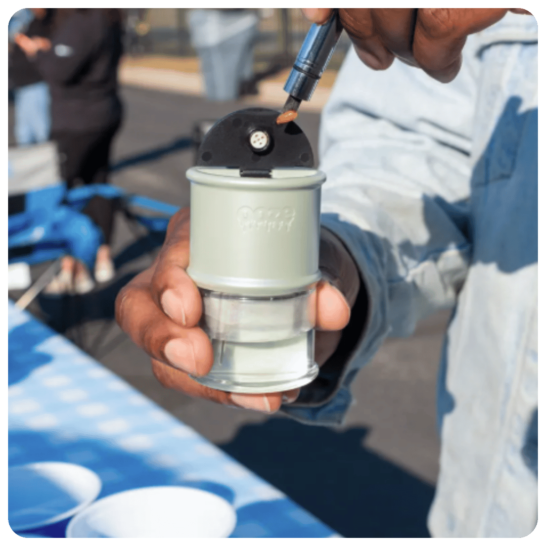 Person loading a dab into an Electro Barrel using a hot knife