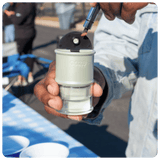 Person loading a dab into an Electro Barrel using a hot knife