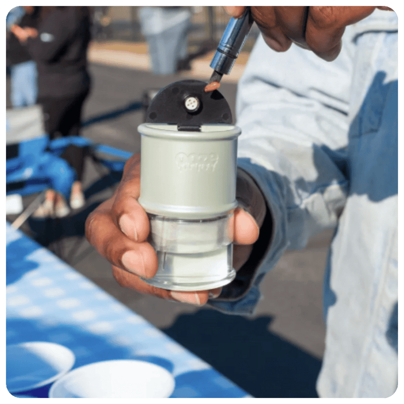 Person loading a dab into an Electro Barrel using a hot knife