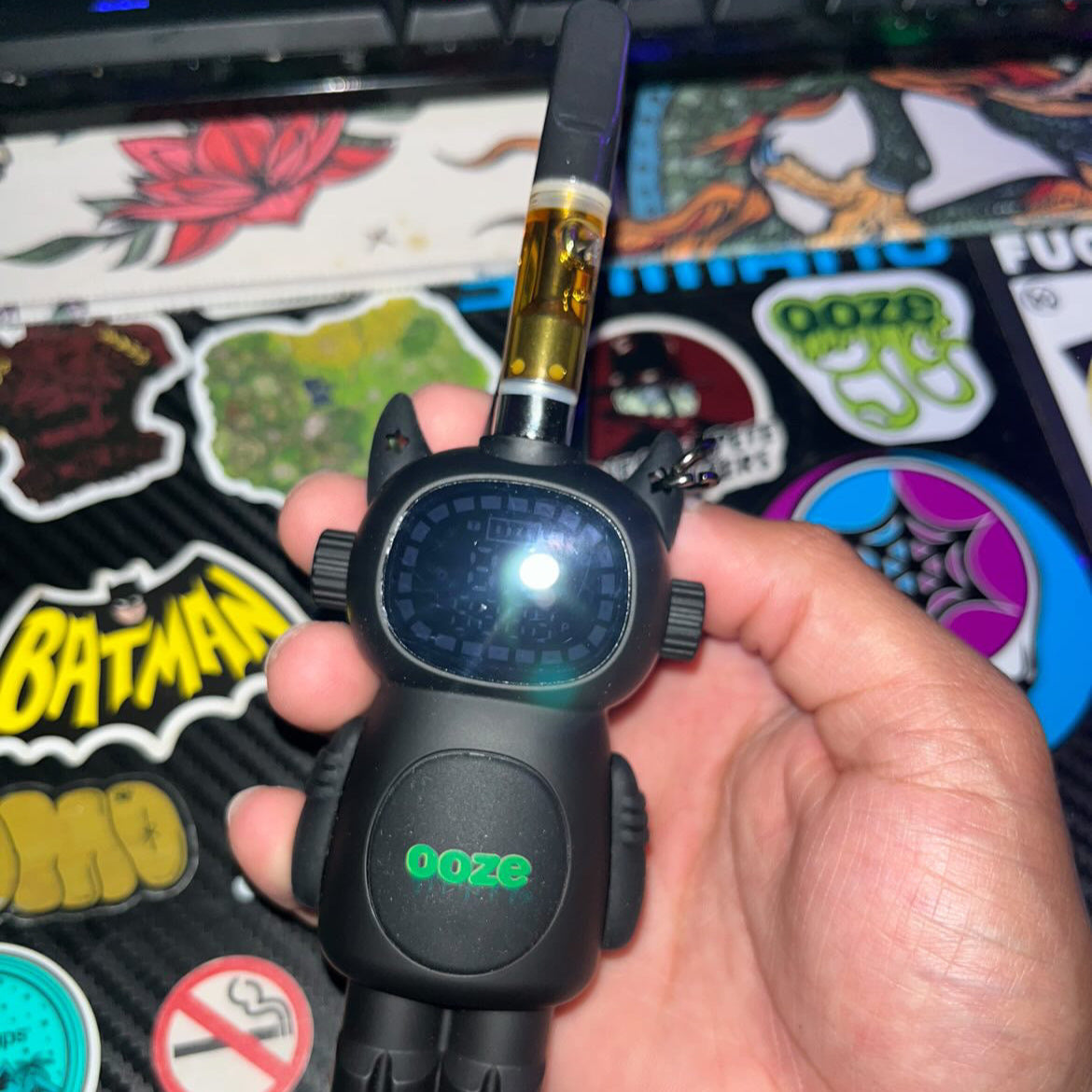 Holding the Black Ooze Bot character vape battery with a cart screwed on top of head. Photo credit @ceftokes