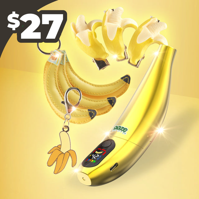Gold Banana-shaped electronic device with keychain on a yellow background