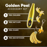 Golden Peel accessory set with peel, hat clips, charm, and keychain on a brown background