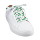 The white Ooze shoelaces are laced into a plain white sneaker and tied in a bow