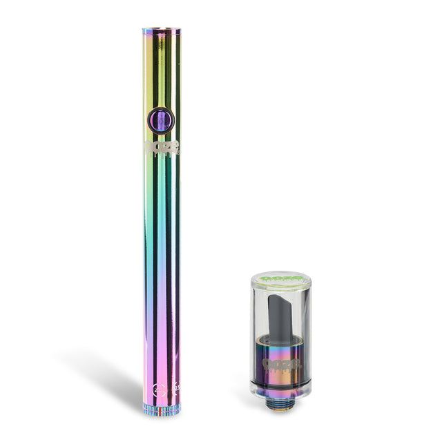 The rainbow Ooze Twist Hot Knife 2.0 is in two pieces. The Twist Slim Pen 2.0 is upright on the left and the 510 attachment with a black ceramic tip is on the right.