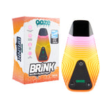 The sunshine Ooze Brink dry herb vape is shown next to the box