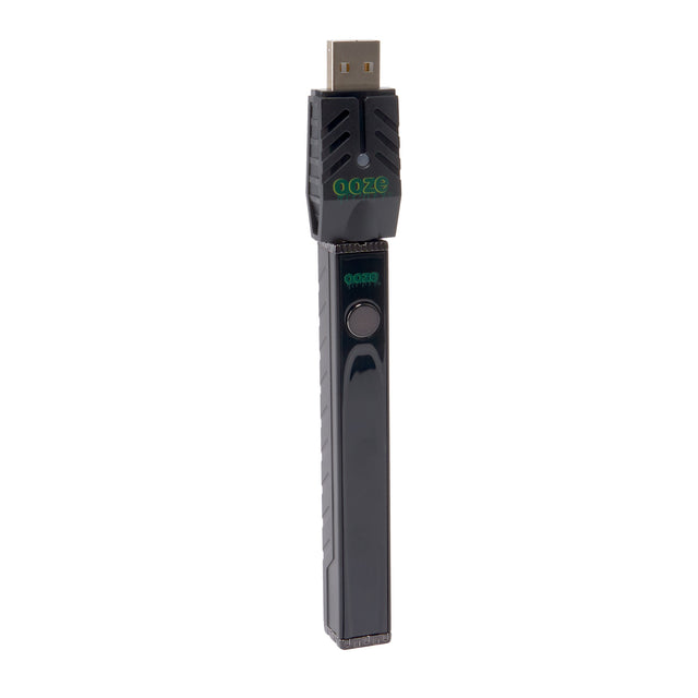 angled view of black Quad 2 square vape including USB charger