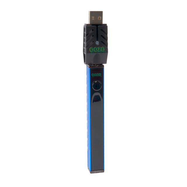 Angled view of the blue Ooze Quad 2 square vape with 510 charger attached on a white background