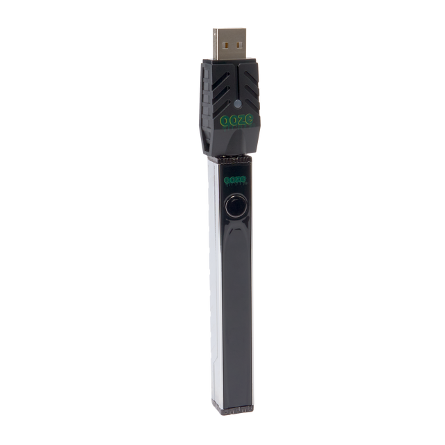 Angled view of the chrome Ooze Quad 2 square vape battery with 510 charger attached on a white background