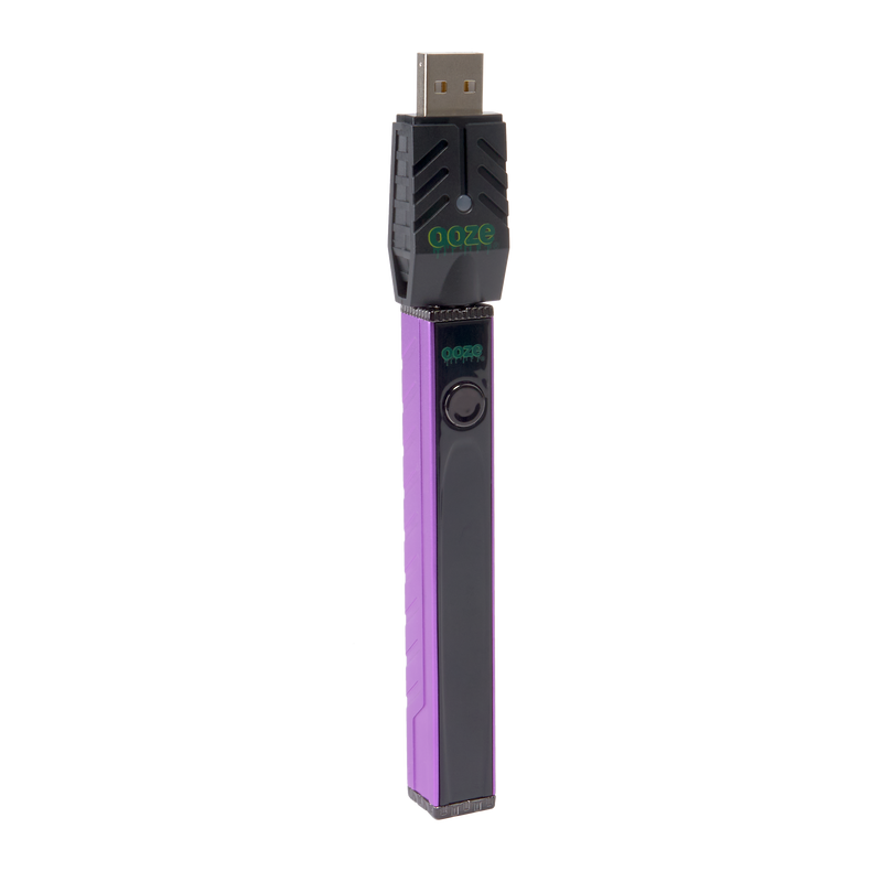 Angled view of the purple Ooze Quad 2 square vape battery with 510 charger attached against a white background