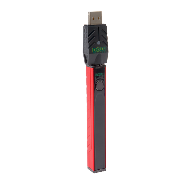 Angled view of the red Ooze Quad 2 square vape battery with 510 charger attached against a white background