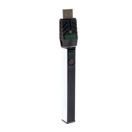 Angled view of the white Ooze Quad 2 vape battery with a 510 charger attached on a white background