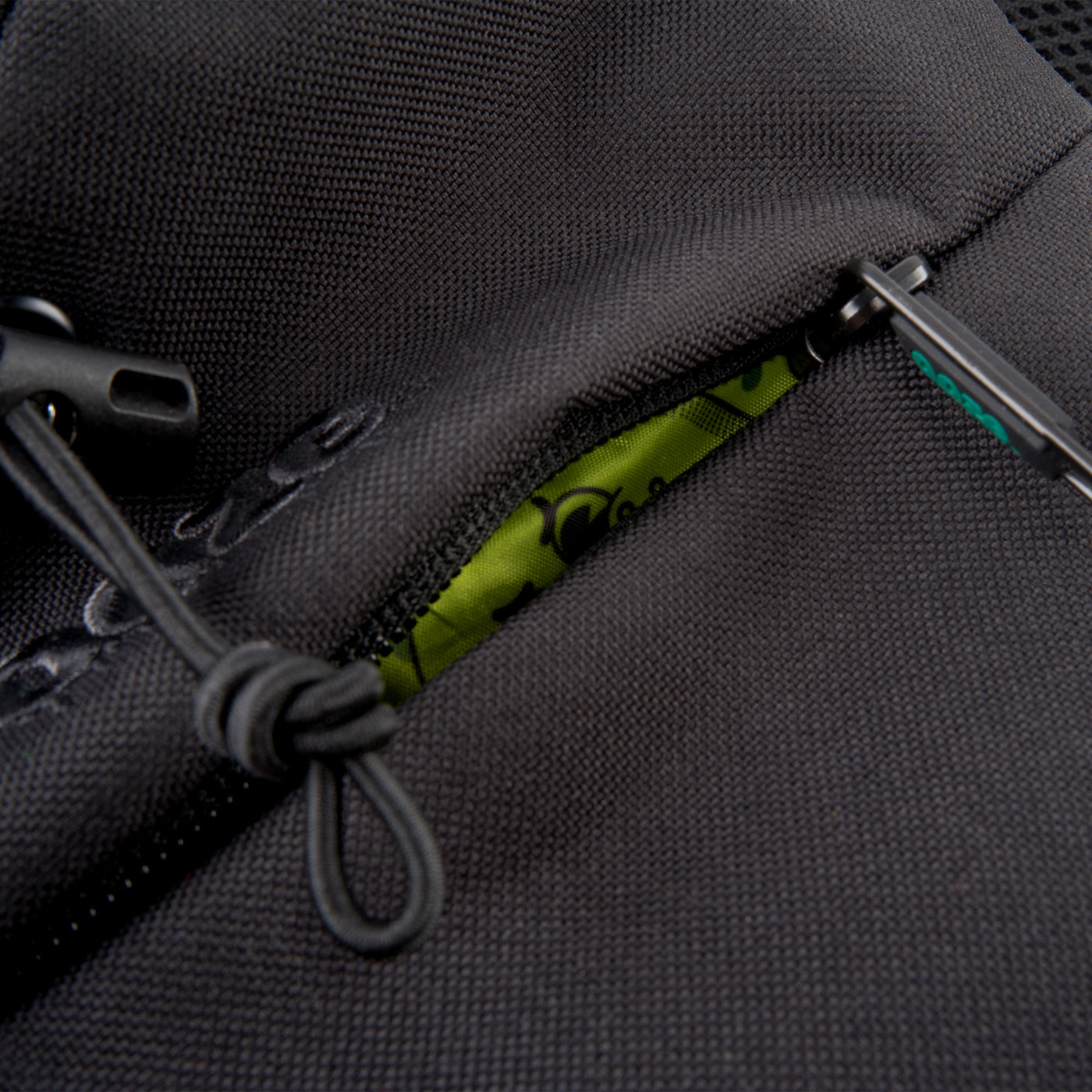 Close up of the zipper of Black smell proof Traveler Series crossbody bag