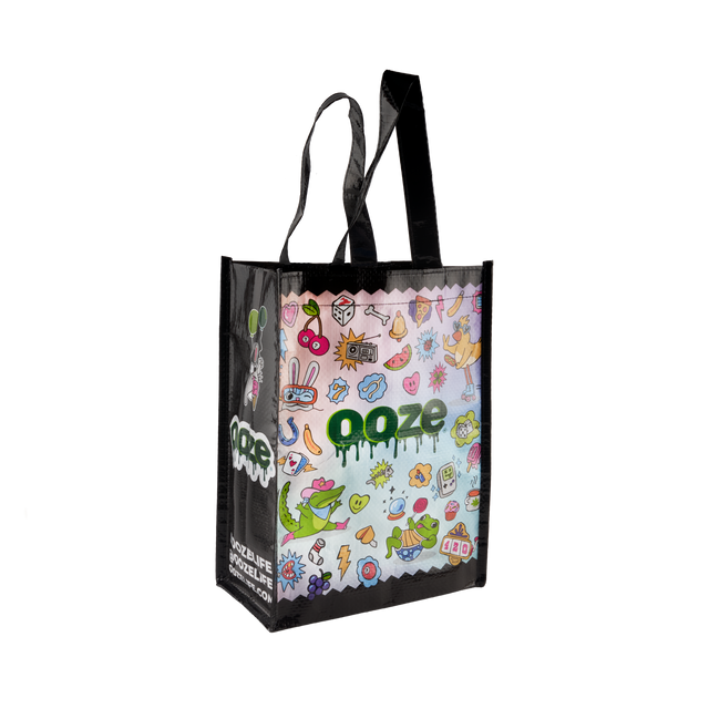 Small reusable tote bag with a colorful front design, Ooze logo, and black sides and handles