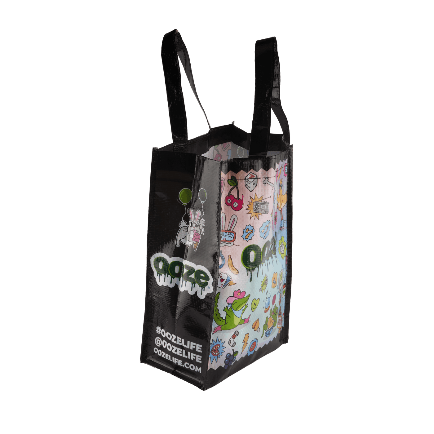 Side view of the colorful Ooze Hotel Lucky large reusable tote bag with black sides and handles