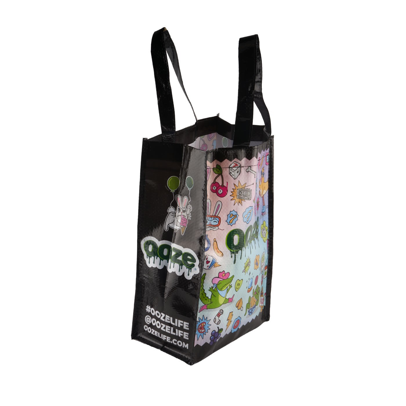 Angled view of the small Ooze reusable Hotel Lucky tote bag with colorful design and black sides and handles