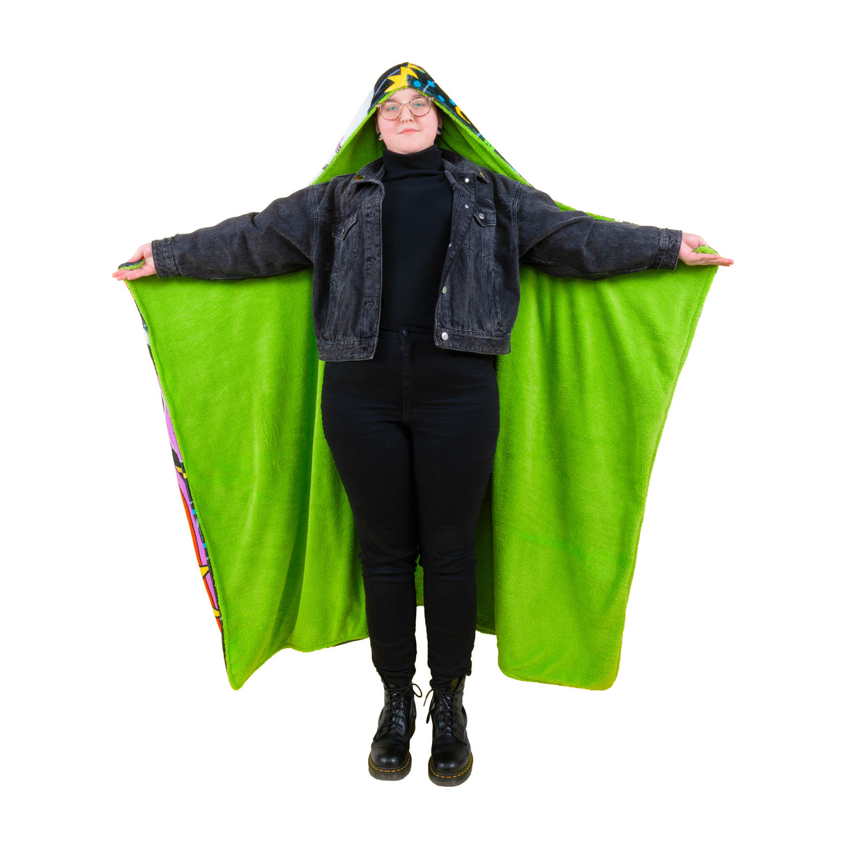 Wearing the Time Warp fuzzy hooded blanket with arms extended to show the green underside