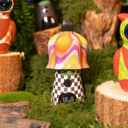 Colorful mushroom figurine with a checkered pattern on a grassy background
