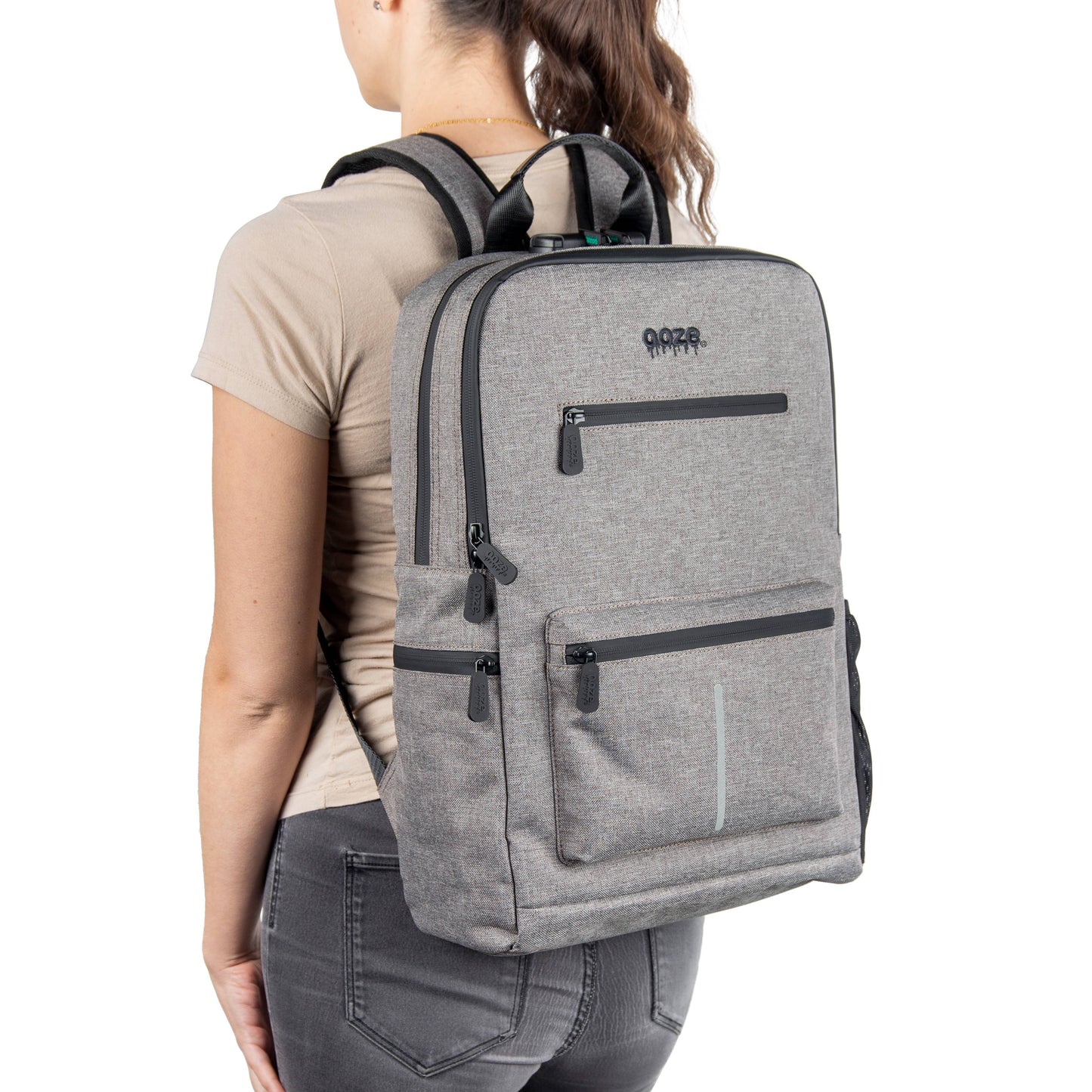 A girl is wearing the smoke gray Ooze backpack