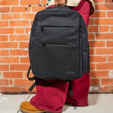 Holding the Gray smell proof Traveler Series backpack 