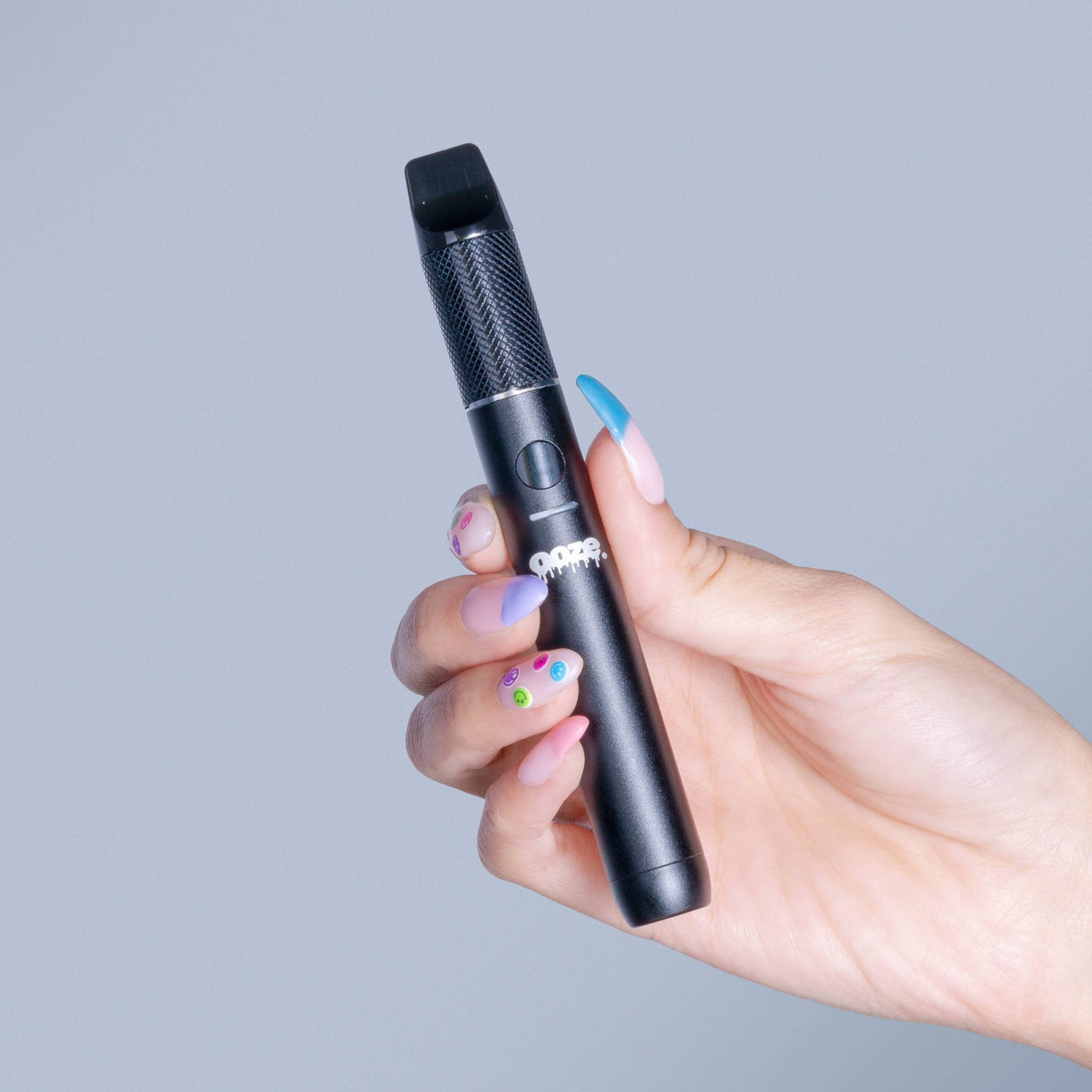 Holding up a black Beacon dab pen