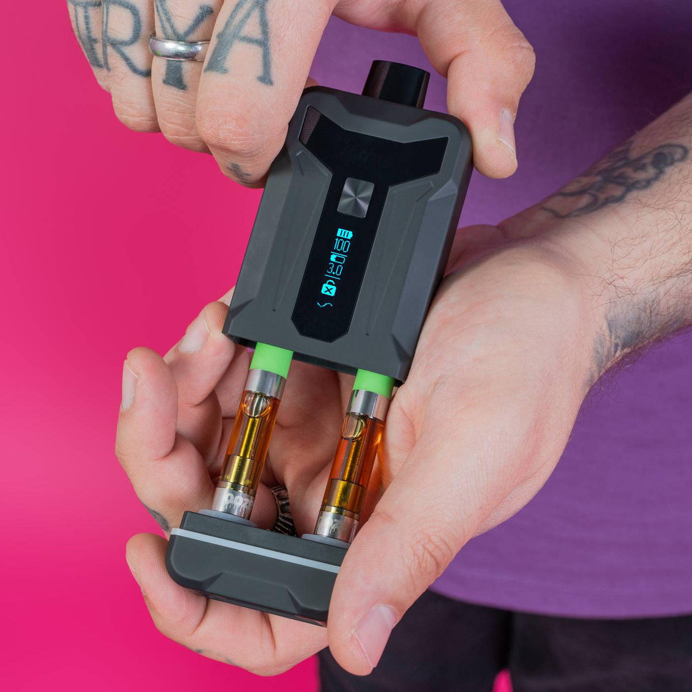 Pulling base out of a black Duet to reveal two attached carts