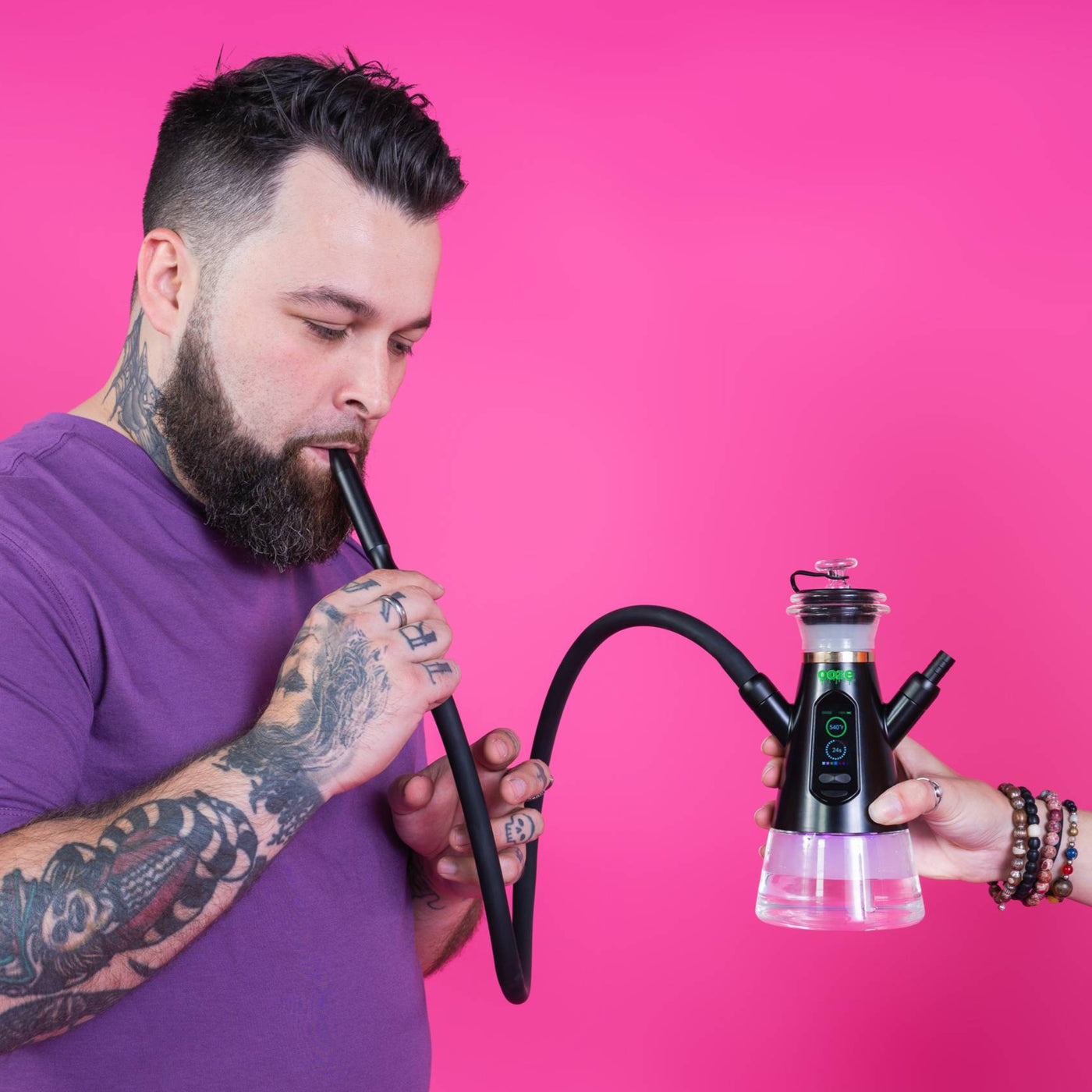Taking a dab from a Ripley dab rig hookah