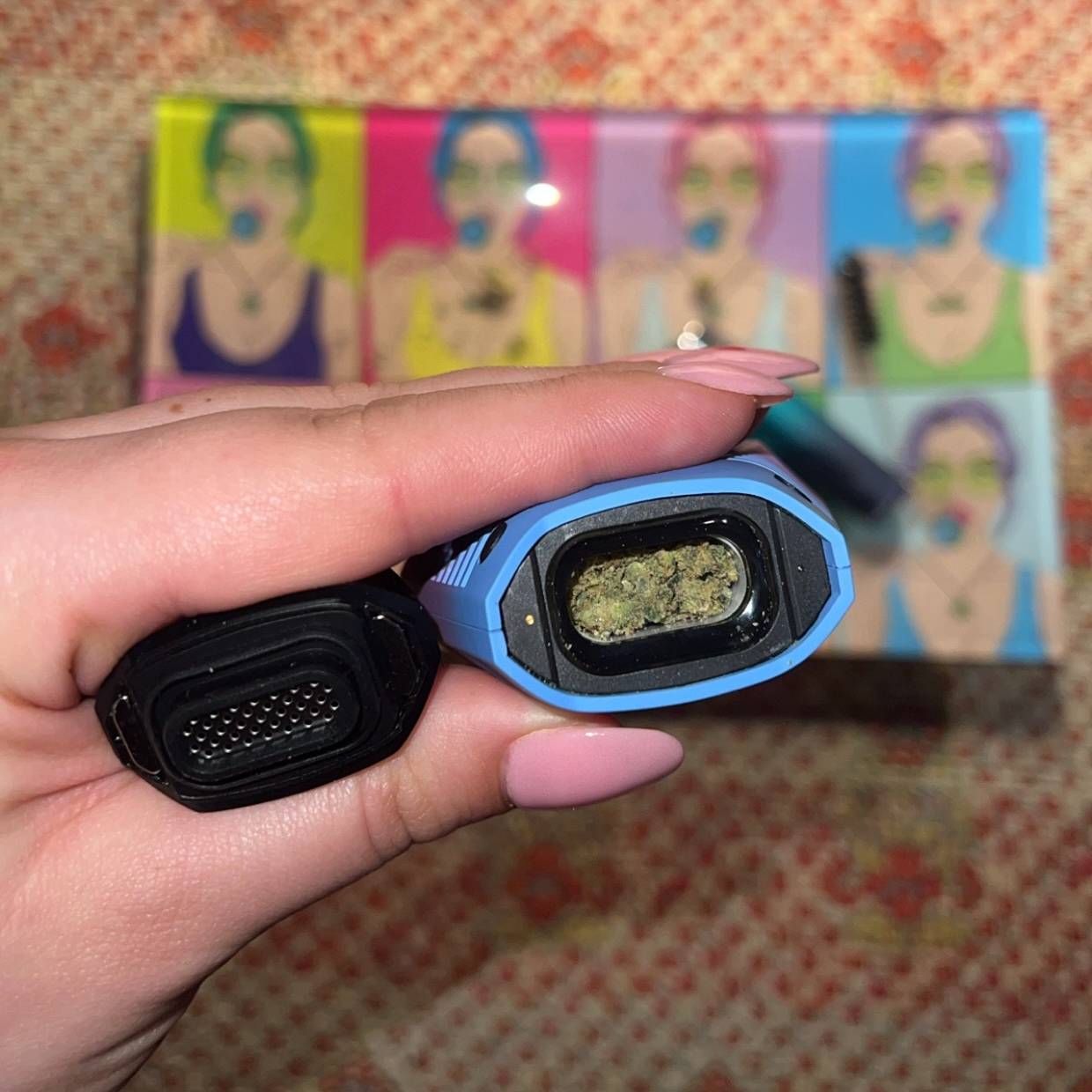 Inside of Brink blue and purple vape pen and showing the flower