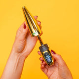 Person removing cap from gold Peel banana battery to show the cartridge inside