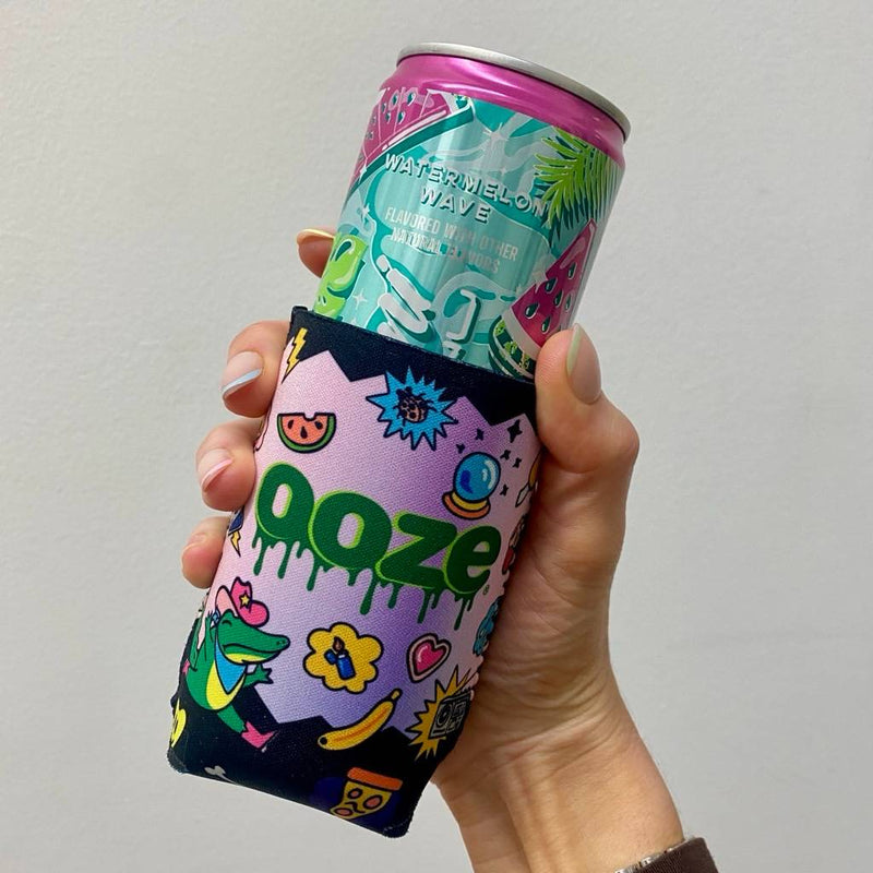 The Ooze Hotel Lucky koozie on a slim Alani Nu energy drink can