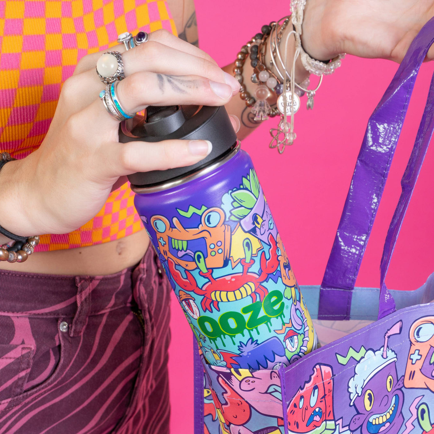 Pulling the Hype Engine water bottle out of a Hype Engine reusable bag