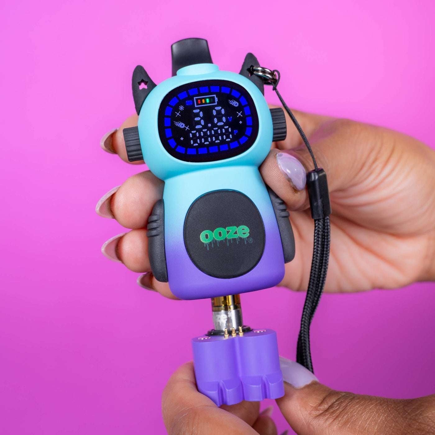 Pulling the purple legs out from the Moonrise Ooze Bot character vape battery 