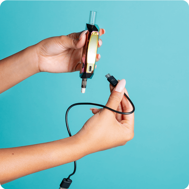 A girl plugs the charger into the gold Ooze Pronto