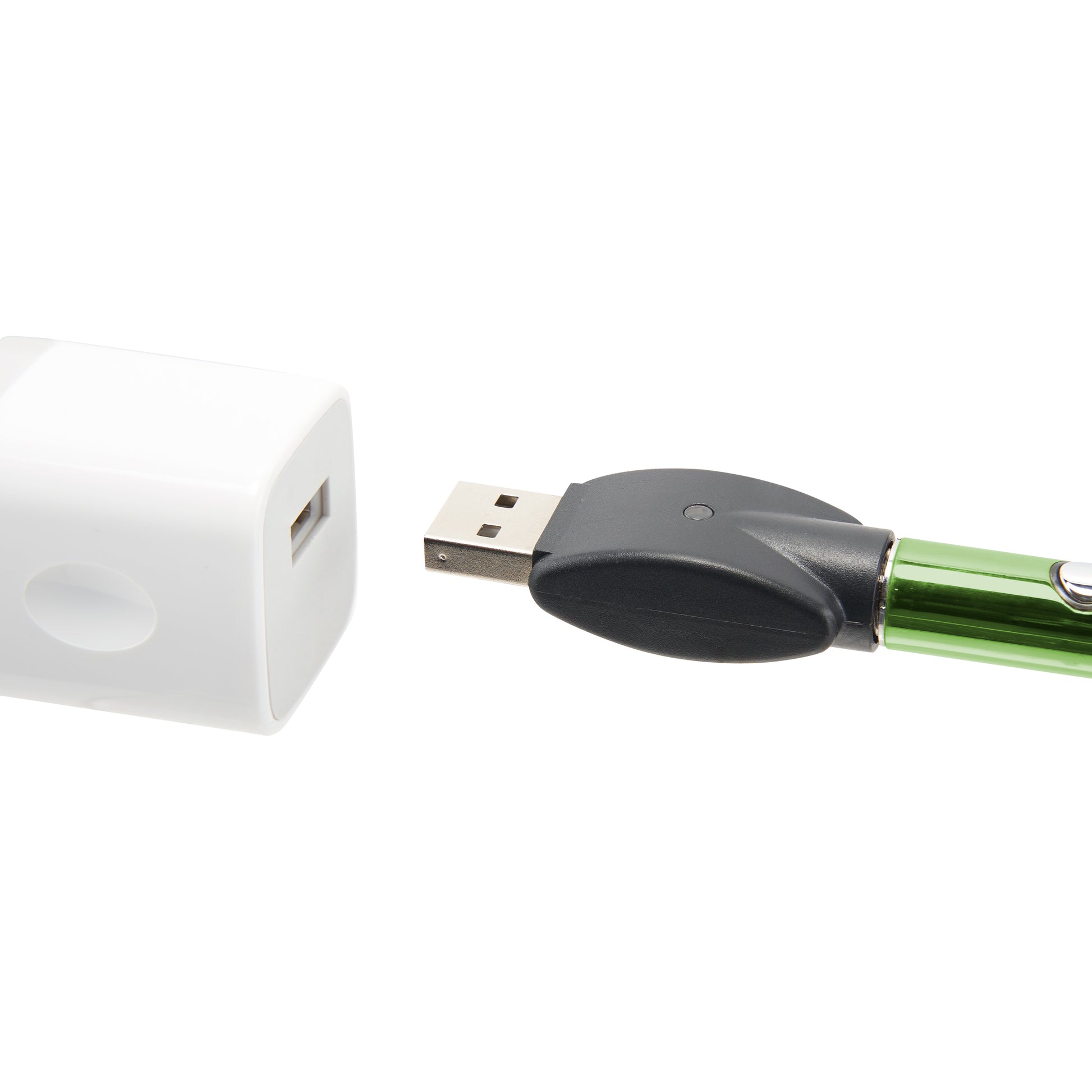 The green Ooze Wink flashlight vape is plugged into its 510 charger, being plugged into a white USB wall adapter