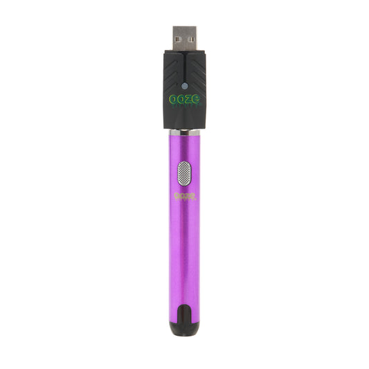 The ultra purple Ooze Smart Battery is upright with the charger attached