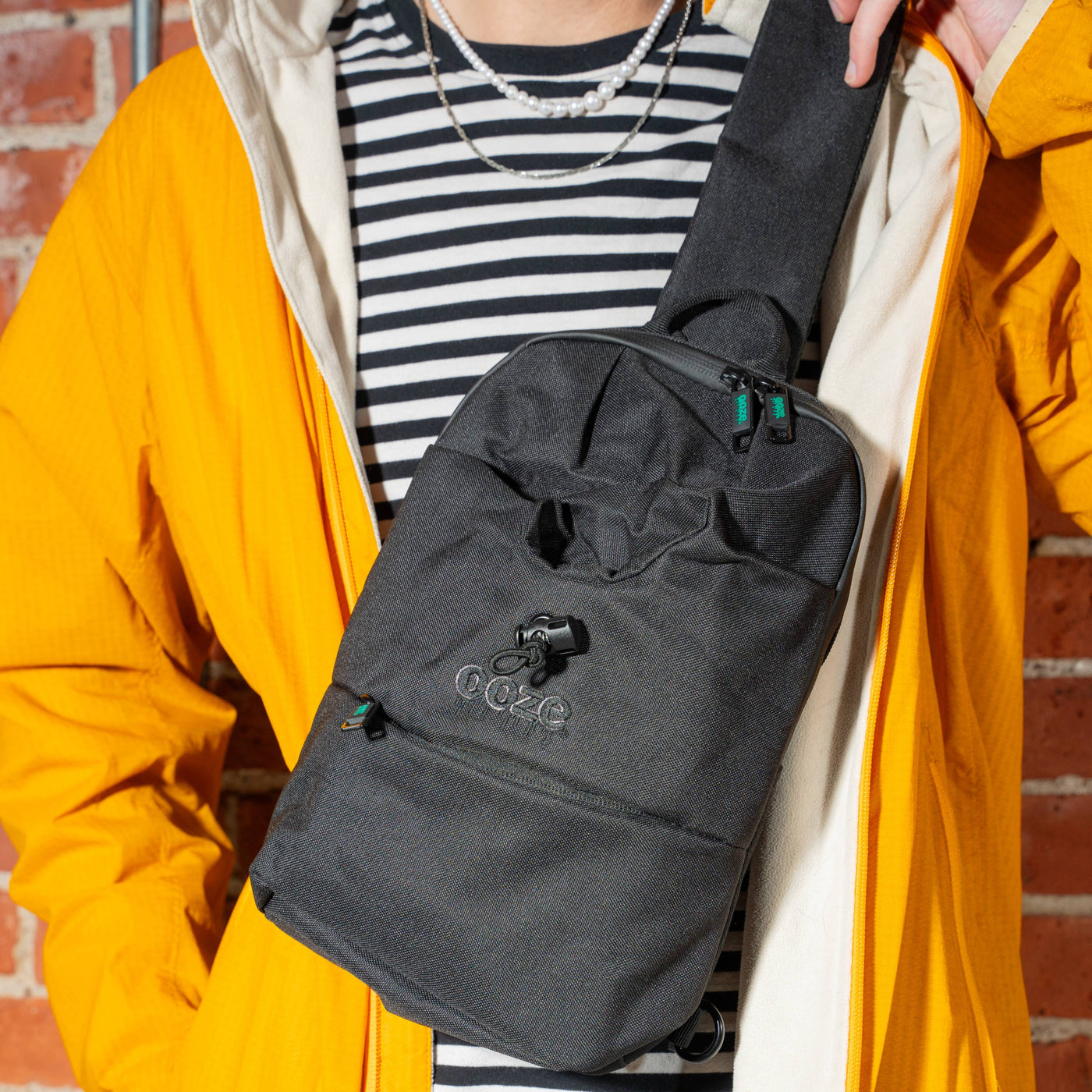 Wearing the Black smell proof Traveler Series crossbody bag