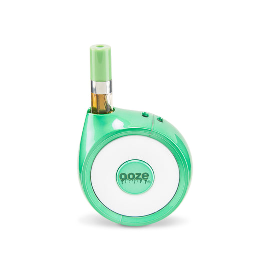 The Ooze Movez Speaker Vape in Mary Jade is shown with a cartridge in the chamber.